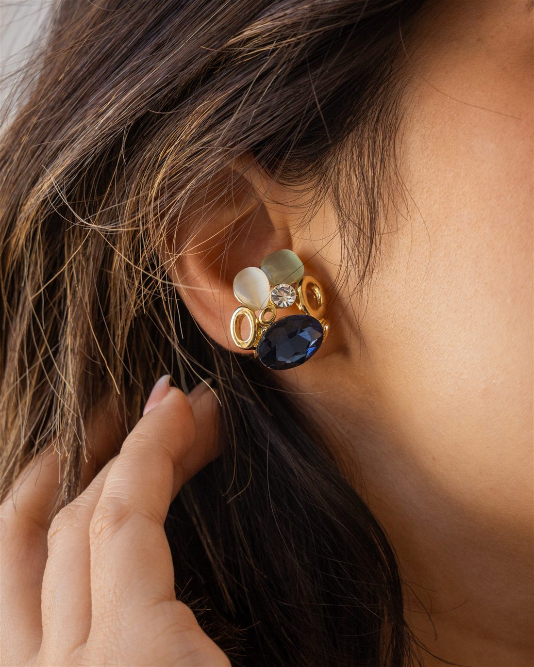 Gold cluster earring with navy crystal