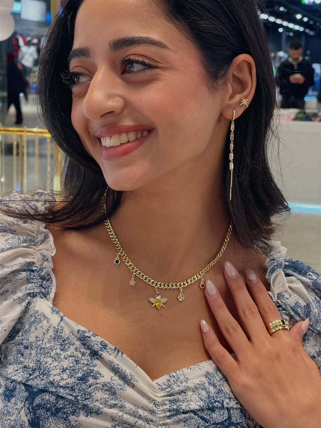Gold bee charm necklace with star studs and crystal threader